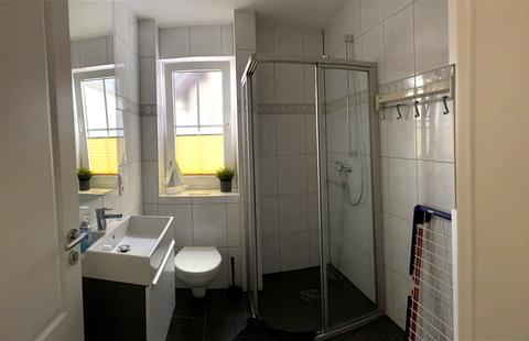 Bathroom with shower and window