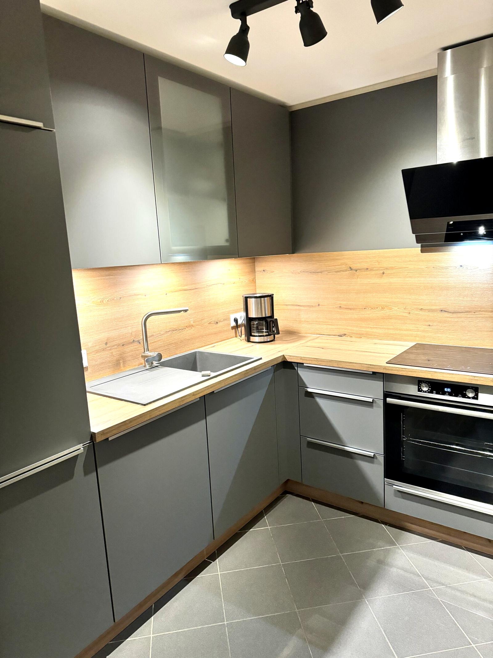 Fully equipped kitchen with ceramic hob, oven and dishwasher