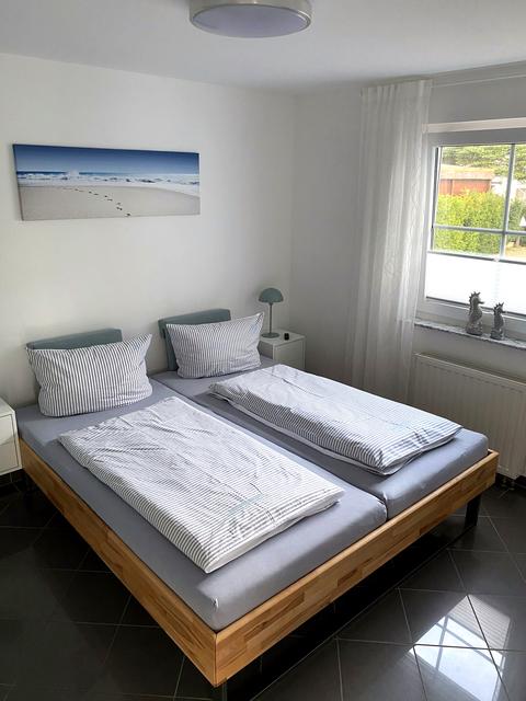 Double bedroom with window and bedside tables