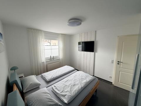 Bedroom with double bed and flat screen TV